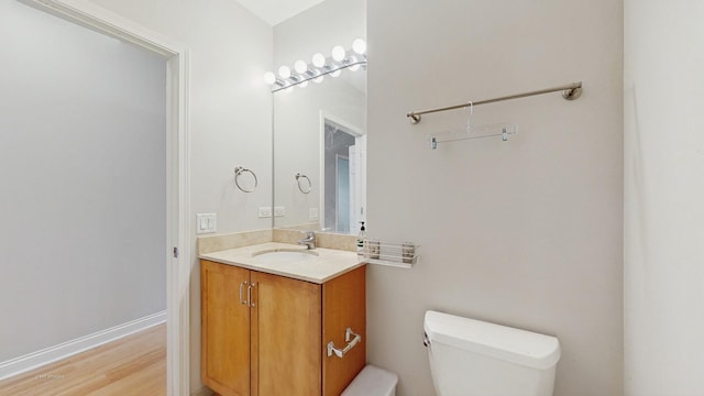 8 W Monroe St Unit 1507, Chicago, IL 60603 - bathroom featuring toilet, vanity, and wood finished floors