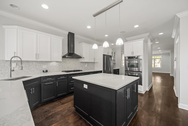 1615 W Superior St, Chicago, IL 60622 - kitchen featuring wall chimney range hood, appliances with stainless steel finishes, a sink, white cabinets, and dark cabinets