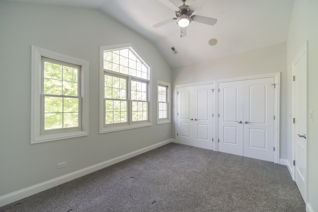 1615 W Superior St, Chicago, IL 60622 - unfurnished bedroom with two closets, lofted ceiling, multiple windows, carpet, and baseboards