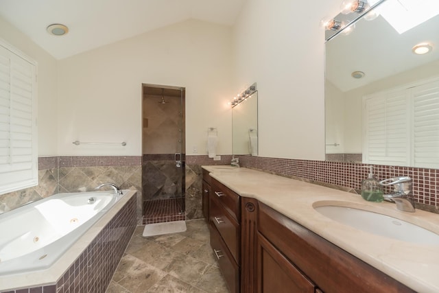 1615 W Superior St, Chicago, IL 60622 - bathroom with lofted ceiling, a tub with jets, a walk in shower, vanity, and a skylight