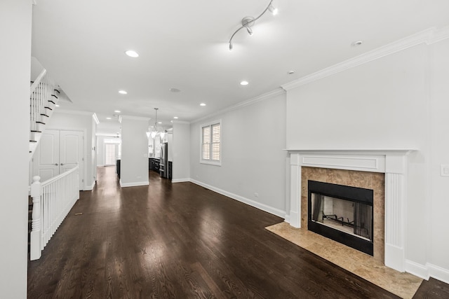 1615 W Superior St, Chicago, IL 60622 - unfurnished living room featuring a tile fireplace, crown molding, baseboards, dark wood-type flooring, and recessed lighting