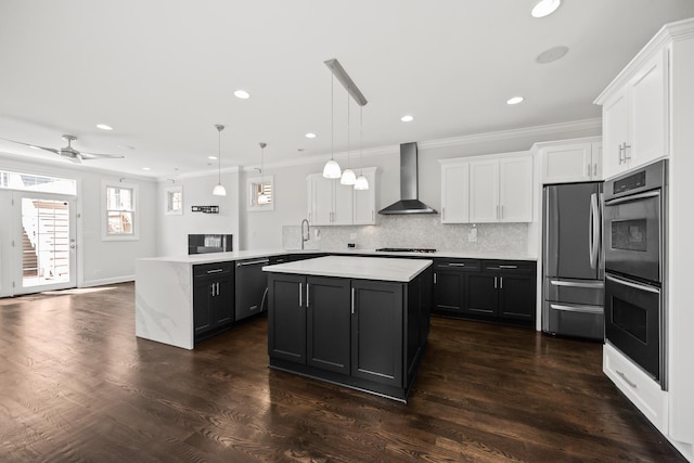 1615 W Superior St, Chicago, IL 60622 - kitchen featuring wall chimney exhaust hood, stainless steel appliances, ornamental molding, a sink, and light countertops