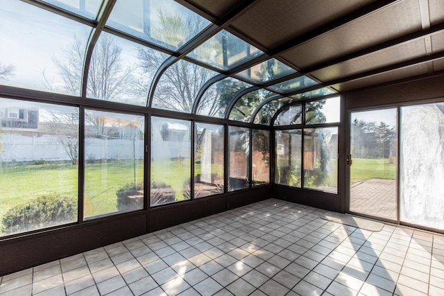 unfurnished sunroom featuring a healthy amount of sunlight