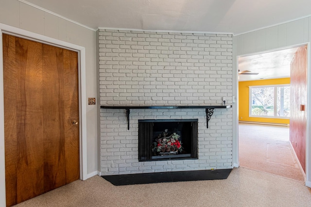 unfurnished living room with a fireplace, carpet, a baseboard radiator, and ornamental molding