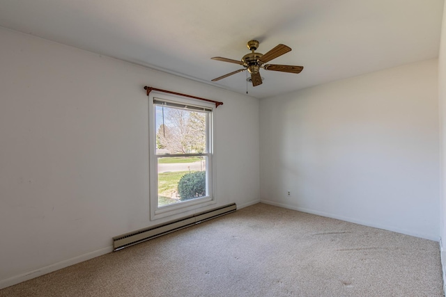 carpeted empty room with ceiling fan, a baseboard heating unit, and baseboards