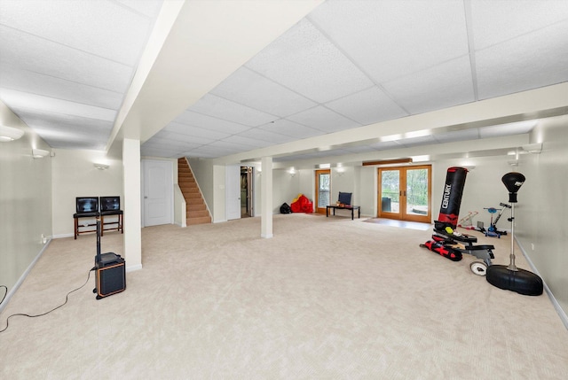 workout area with french doors, baseboards, and carpet floors