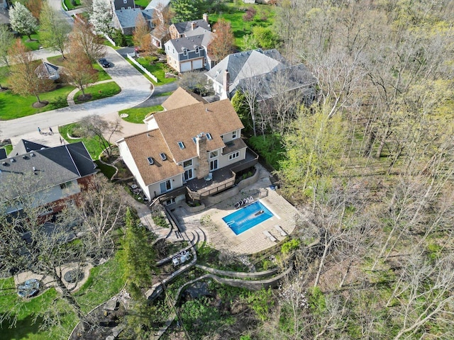 birds eye view of property with a residential view