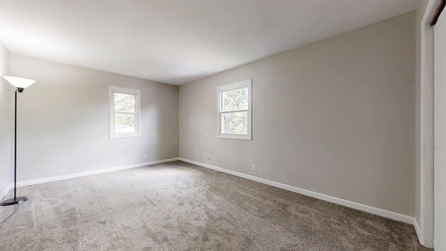 912 Crescent Dr Unit 2-4, Champaign, IL 61821 - carpeted empty room featuring baseboards