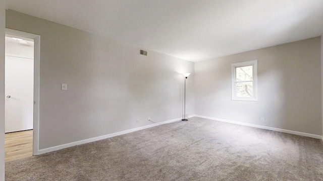 912 Crescent Dr Unit 2-4, Champaign, IL 61821 - carpeted spare room with baseboards