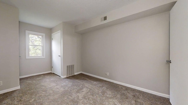 912 Crescent Dr Unit 2-4, Champaign, IL 61821 - carpeted empty room featuring baseboards