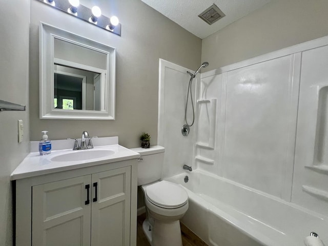 912 Crescent Dr Unit 2-4, Champaign, IL 61821 - bathroom featuring vanity,  shower combination, toilet, a textured ceiling, and wood finished floors