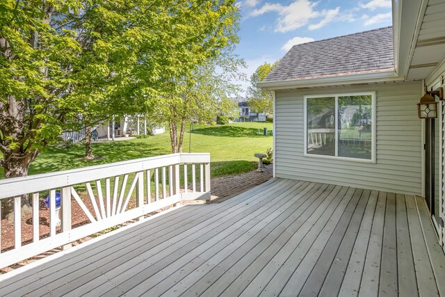wooden terrace with a yard