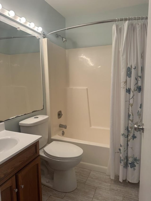 217 Uteg St Unit A, Crystal Lake, IL 60014 - bathroom with toilet, vanity, and shower / bathtub combination with curtain