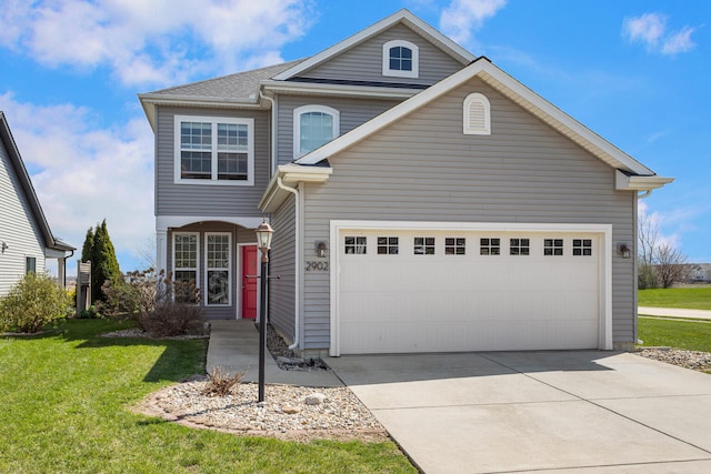 traditional-style home with driveway, an attached garage, and a front lawn