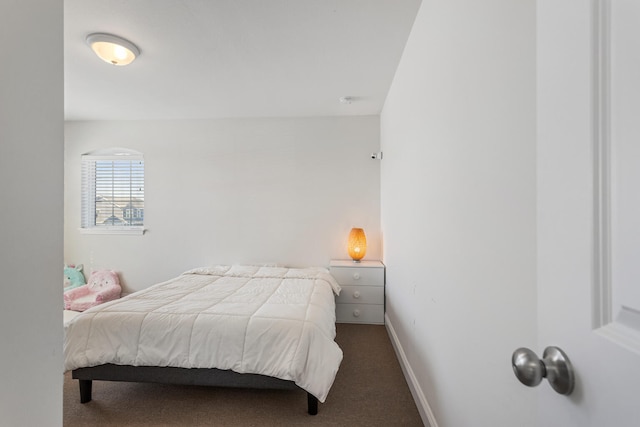 carpeted bedroom with baseboards