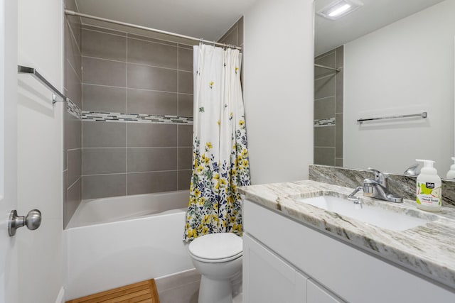 bathroom featuring shower / bath combo with shower curtain, vanity, and toilet