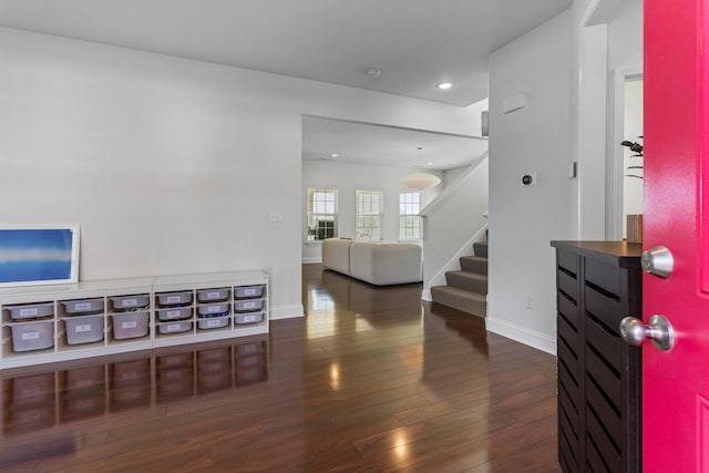 foyer with recessed lighting, stairs, baseboards, and hardwood / wood-style flooring