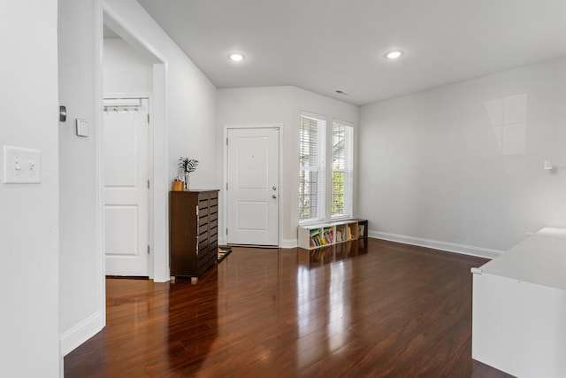 foyer entrance with recessed lighting, baseboards, and wood finished floors