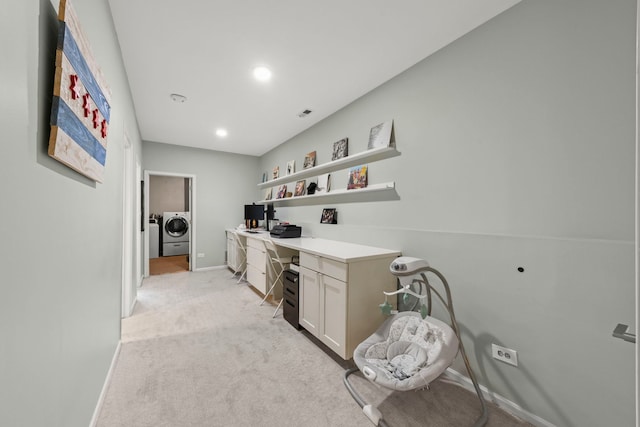 office with baseboards, built in study area, recessed lighting, washer and clothes dryer, and light colored carpet