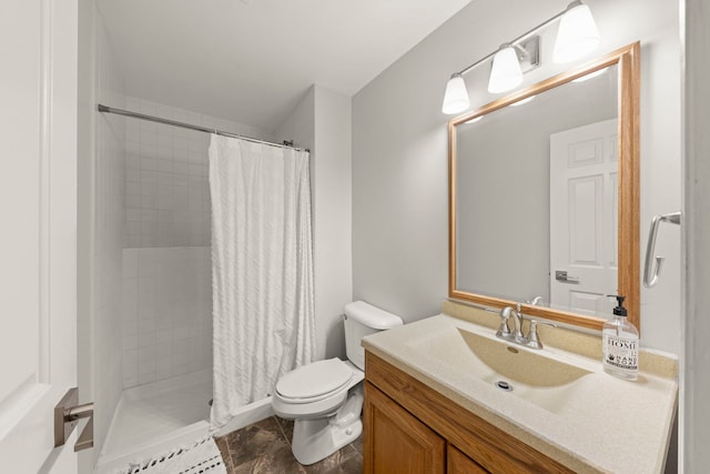 bathroom featuring toilet, vanity, and a tile shower