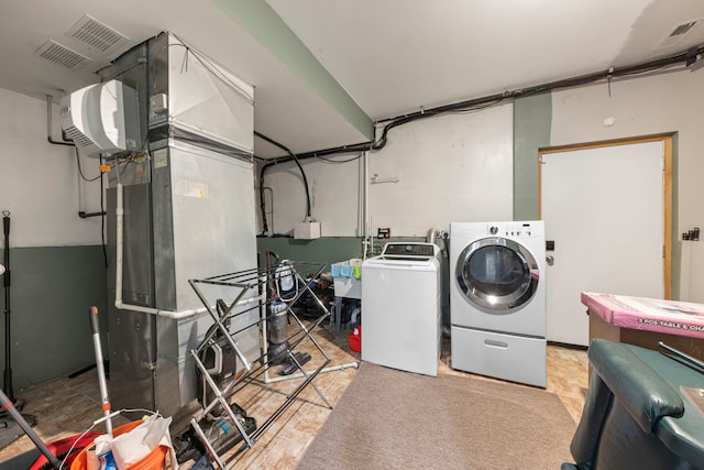 laundry room with visible vents, independent washer and dryer, and laundry area