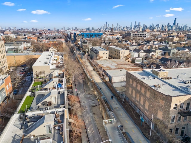birds eye view of property featuring a view of city