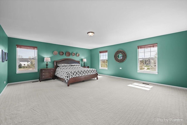 bedroom featuring carpet floors and baseboards