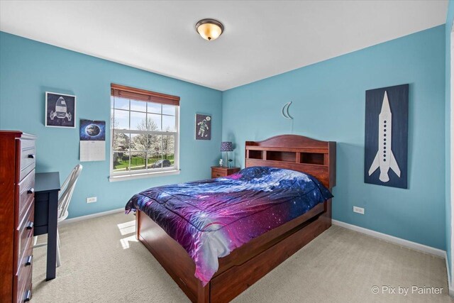 carpeted bedroom with baseboards