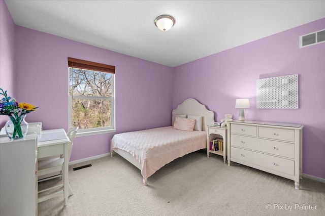 bedroom featuring light colored carpet, visible vents, and baseboards