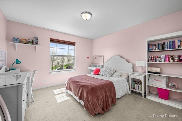 bedroom with baseboards and carpet flooring