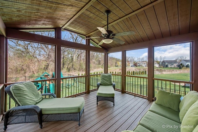 sunroom / solarium featuring ceiling fan
