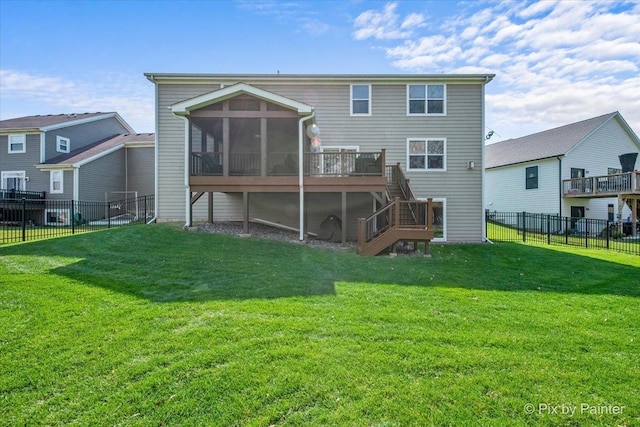 rear view of property featuring stairway, a yard, a fenced backyard, and a sunroom