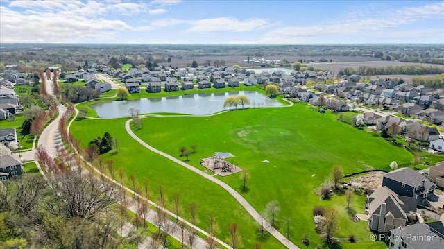 birds eye view of property featuring a water view, a residential view, and view of golf course