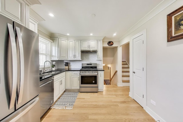 5740 Alabama Ave, Clarendon Hills, IL 60514 - kitchen featuring light wood finished floors, a sink, backsplash, appliances with stainless steel finishes, and ornamental molding