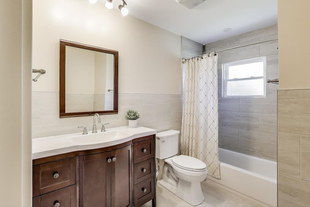 5740 Alabama Ave, Clarendon Hills, IL 60514 - full bath with wainscoting, vanity, tile walls, toilet, and shower / bath combo with shower curtain