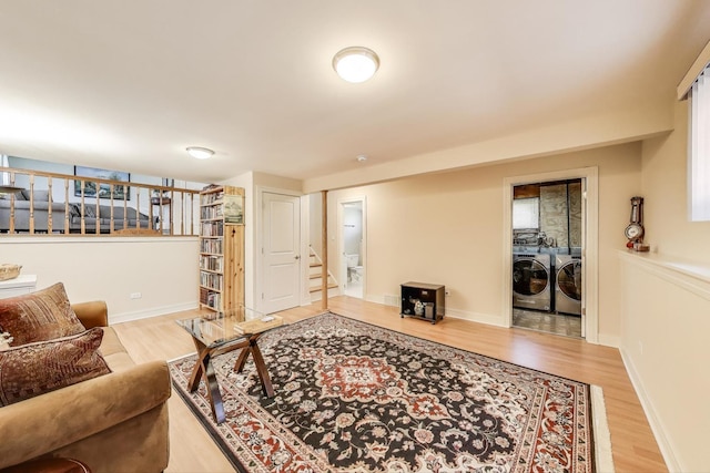 5740 Alabama Ave, Clarendon Hills, IL 60514 - living room featuring baseboards, light wood-type flooring, stairs, and washer and dryer