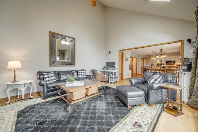 2624 Haddassah Dr, Naperville, IL 60565 - living room featuring high vaulted ceiling, an inviting chandelier, and wood finished floors