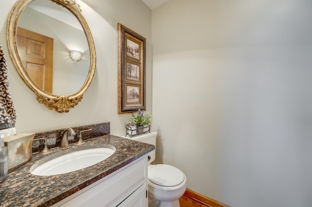 2624 Haddassah Dr, Naperville, IL 60565 - half bathroom featuring toilet, wood finished floors, and vanity