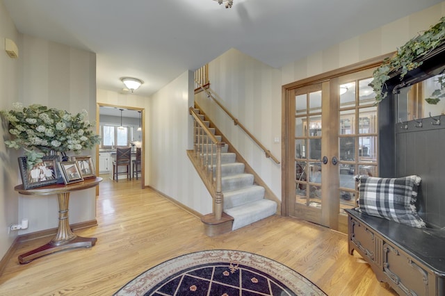 2624 Haddassah Dr, Naperville, IL 60565 - entrance foyer with light wood-style floors, french doors, baseboards, and stairway