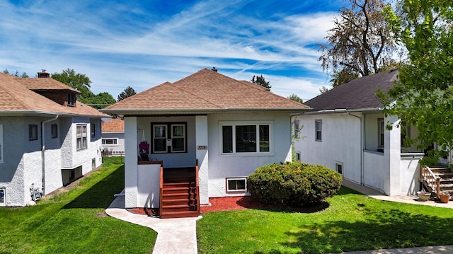 3715 Clinton Ave, Berwyn, IL 60402 - bungalow-style home featuring stucco siding, a front lawn, and a shingled roof