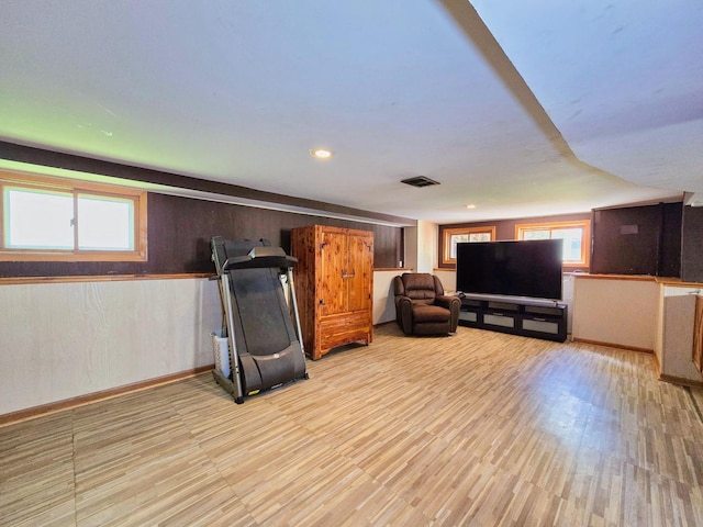 3715 Clinton Ave, Berwyn, IL 60402 - living room featuring light wood-style floors and wooden walls