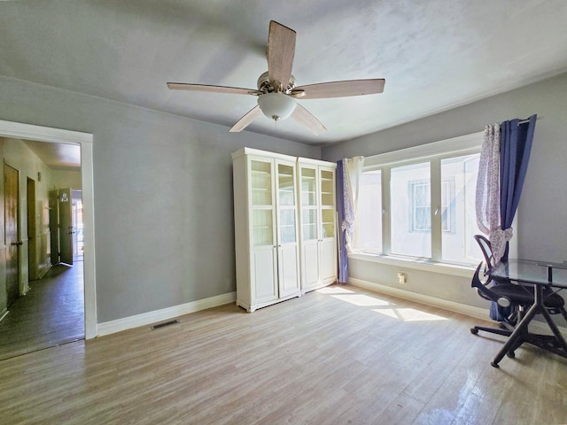 3715 Clinton Ave, Berwyn, IL 60402 - unfurnished office featuring baseboards, wood finished floors, and ceiling fan