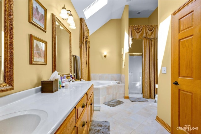 bathroom with double vanity, a bath, a sink, and a stall shower