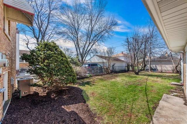 view of yard featuring fence private yard and central air condition unit
