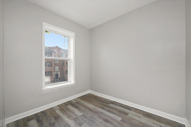 6611 S Peoria St, Chicago, IL 60621 - empty room featuring baseboards and dark wood-style floors
