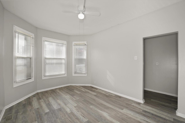 6611 S Peoria St, Chicago, IL 60621 - spare room featuring wood finished floors, a ceiling fan, and baseboards