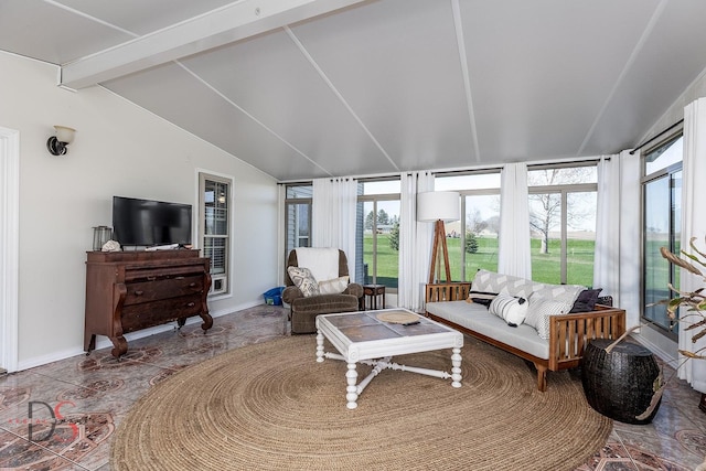 living room with baseboards and vaulted ceiling with beams