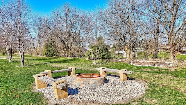 view of yard with an outdoor fire pit