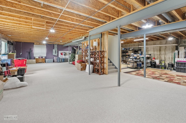 unfinished basement featuring carpet floors and stairs