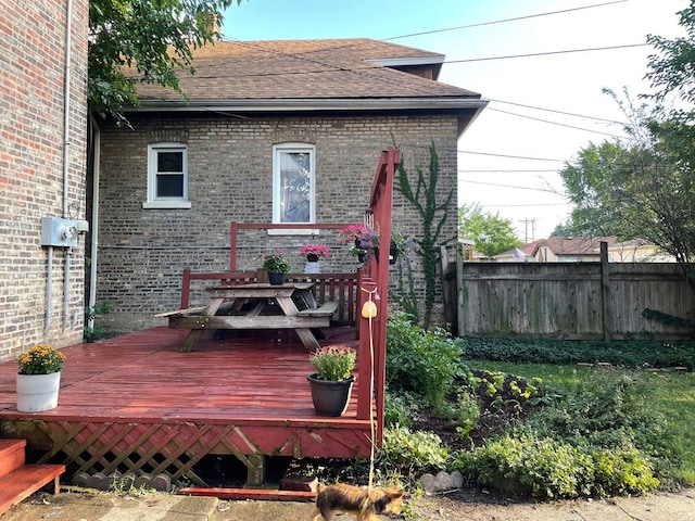 2500 Clarence Ave, Berwyn, IL 60402 - rear view of property featuring roof with shingles, outdoor dining area, brick siding, a wooden deck, and fence